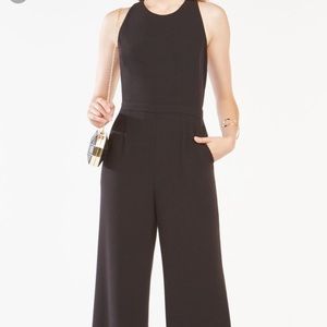 NWT BCBG black jumpsuit w/ cut-out. Sz 0.